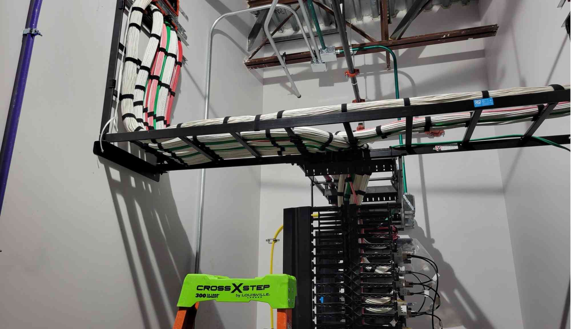 Low voltage room with fiber backbone terminations and structured cabling racks at Fujifilm Cellular Dynamics in Madison, WI.